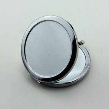 Plain silver-tone round metal compact mirror shown partially open
