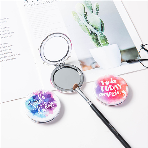 Custom printed round PU leather compact mirrors in a styled beauty scene