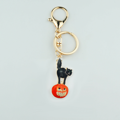 An enamel metal keychain charm used as the closest available reference for a decorative metal bookmark