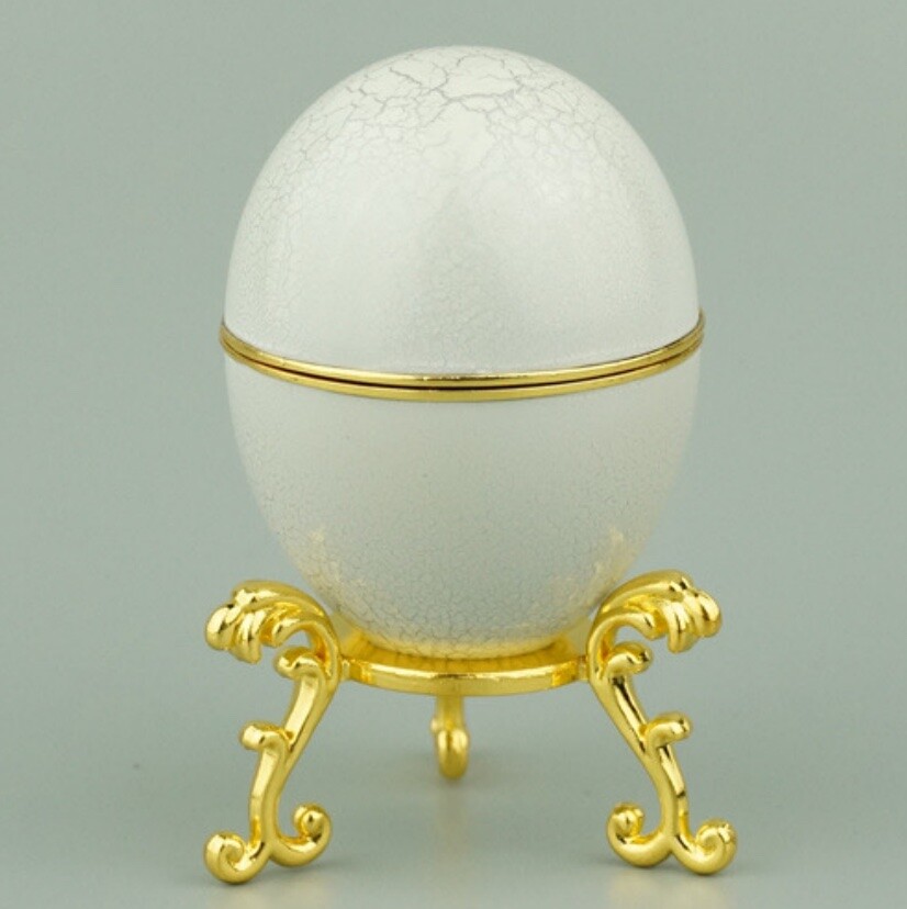 White fine-crackle enamel Hen Egg reproduction on a gold-plated stand
