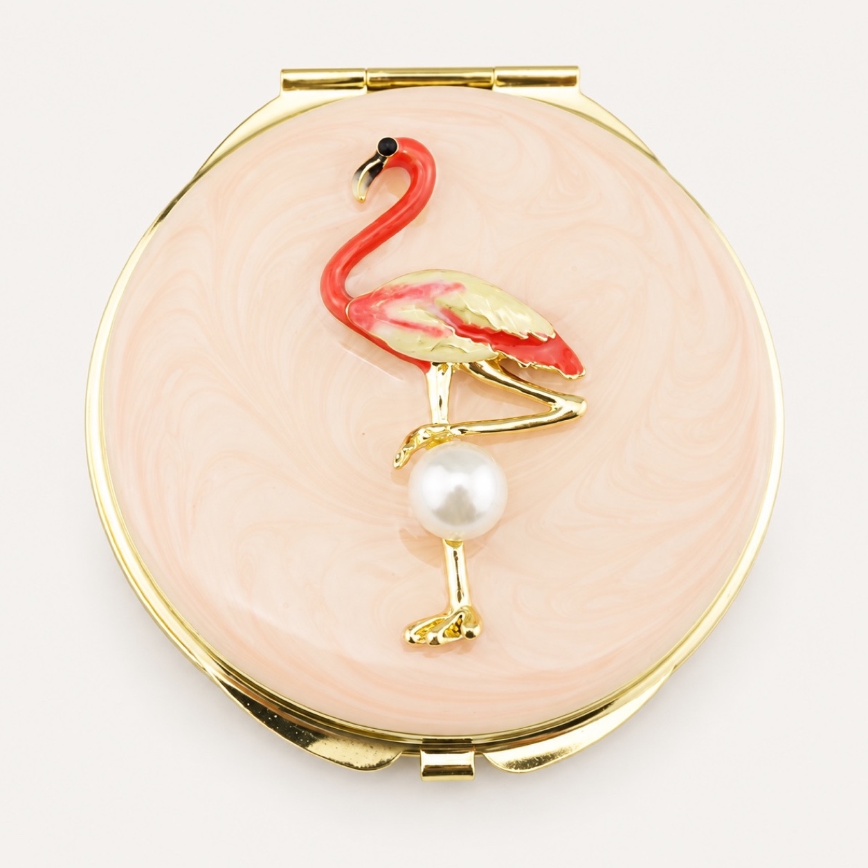 Pink enamel compact mirror with a flamingo charm and pearl accent