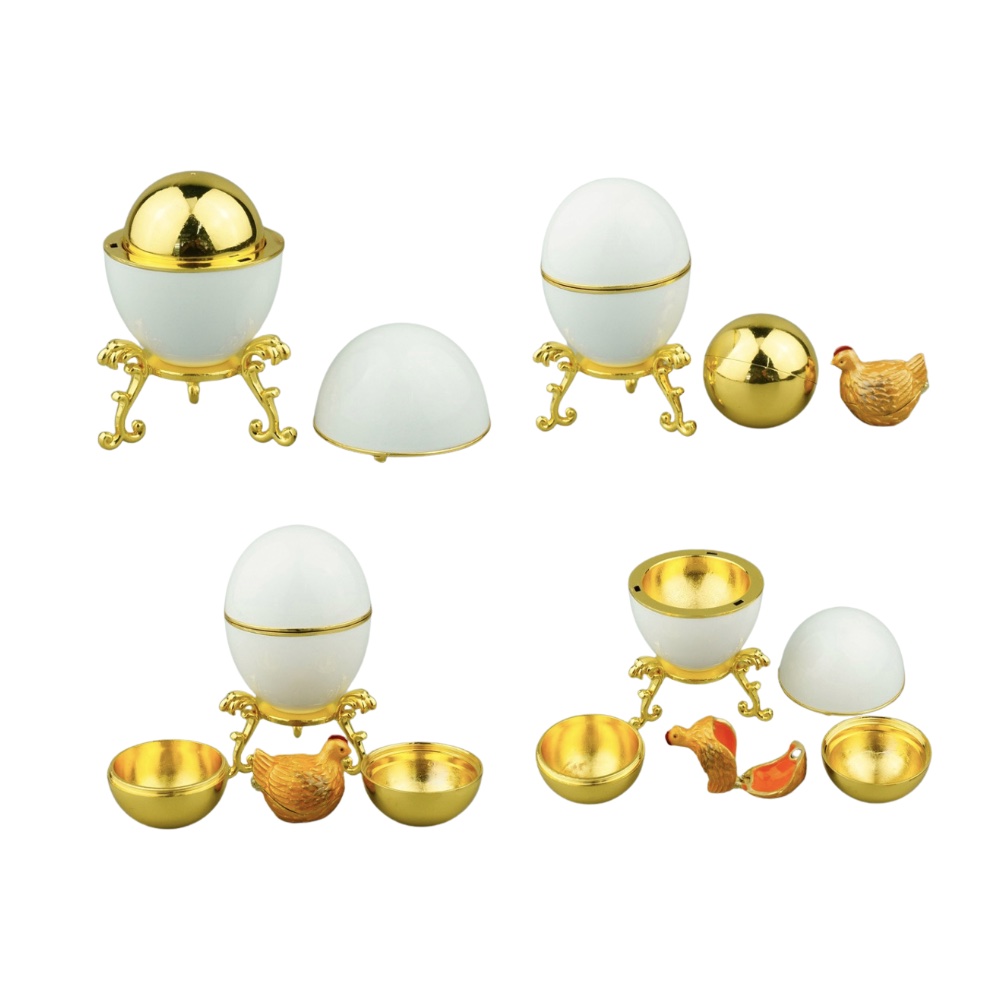 Egg keepsake box opened to show its layered surprise components