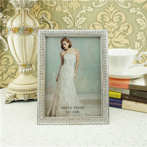 A silver-tone double-row crystal frame for a 5 by 7 inch photo