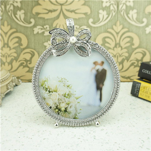 Pearl-Centered Crystal Bow Round Metal Photo Frame