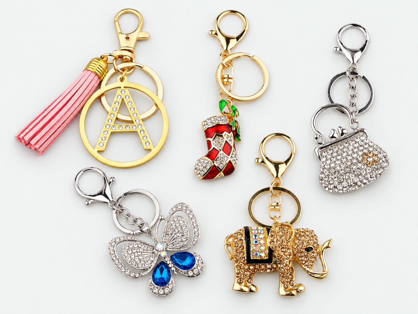 A collection of jeweled, enamel and personalized metal keychains