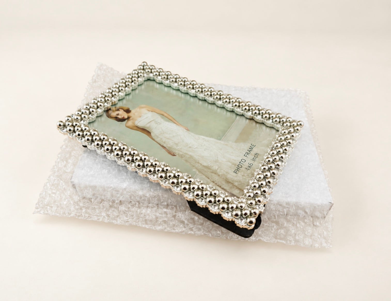 Custom metal picture frame sample reviewed for finish, decorative details, backboard, and stand